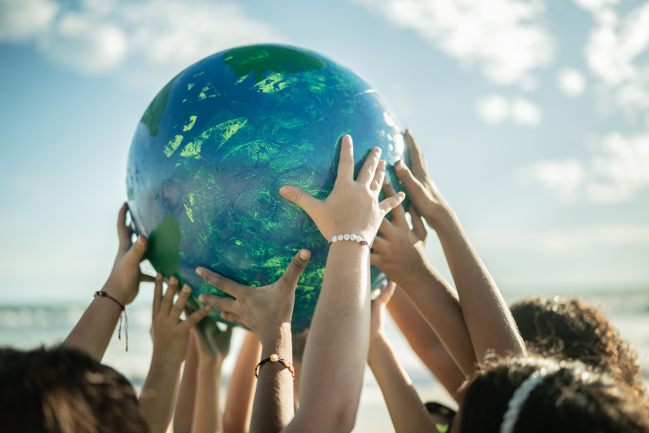 Children Holding Painted Earth